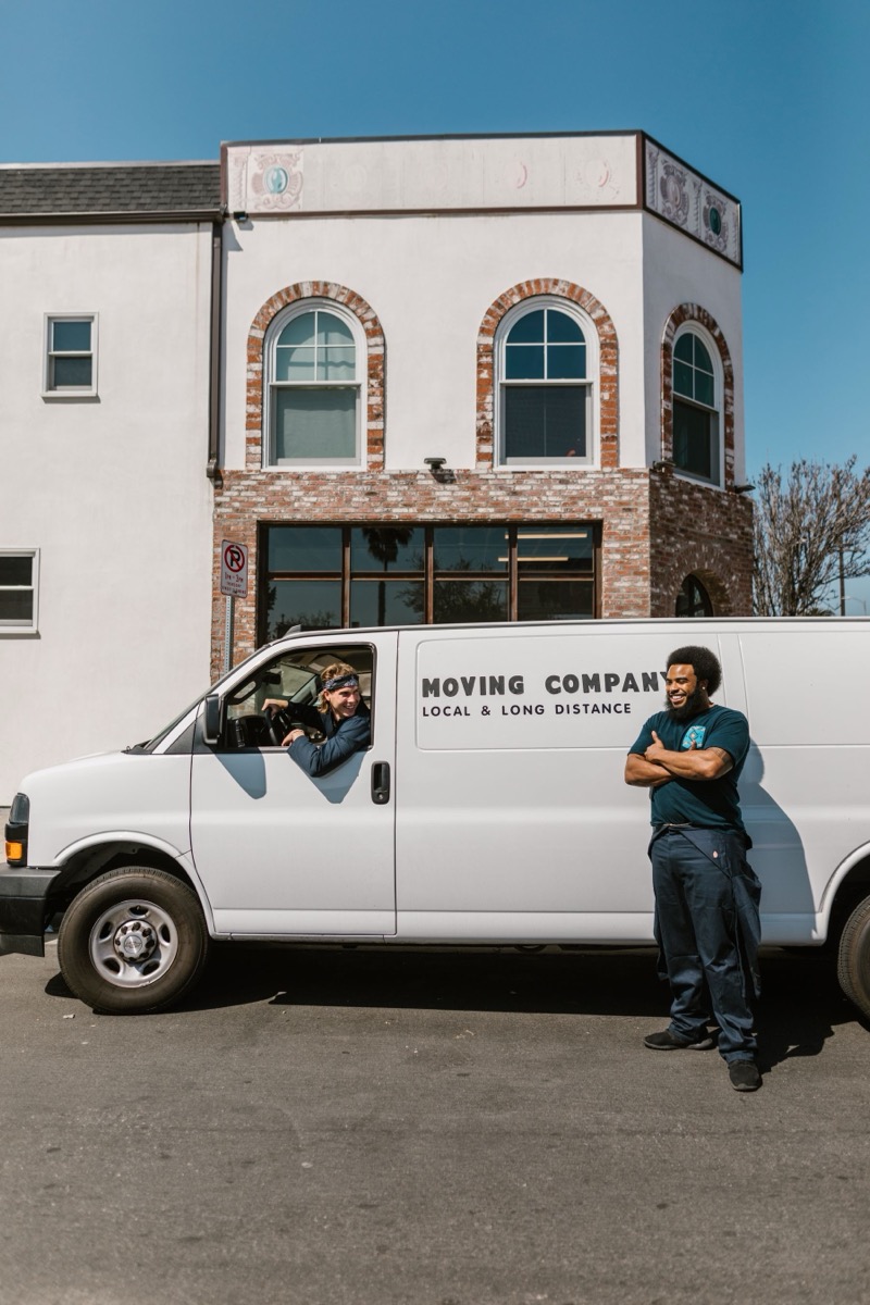 Lanternway moving crew with their van on a sunny street
